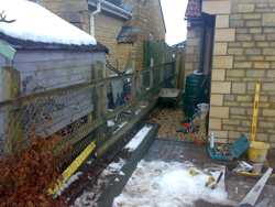 A photo before of old unsightly fence